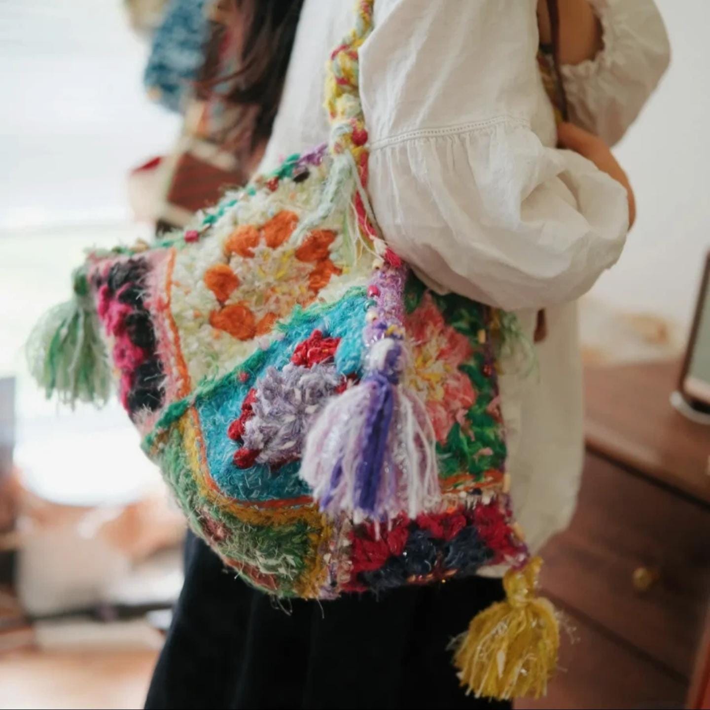 Handmade Boho Dumpling Bag, Colorful Textured Crochet Purse, Chunky Granny Square Tote with Tassels, Artisan Gift for Her